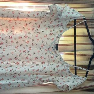 Floral top with ruffled sleeves.